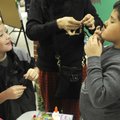 ‘EXPRESS’I-ING HIMSELF - Tristan Snoxhill, 7, left, laughs with Isaac Silva, 8, as he makes a mustac...