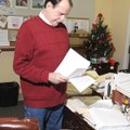 Richard Hoback, Benton County Veterans Service officer, sorts through veterans benefit claims Friday...