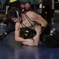 Bentonville’s Austin Gonzalez tries to pin Gentry’s Kolby Rankin during the Northwest Arkansas Duals...