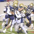 Shiloh Christian senior quarterback Kiehl Frazier carries the ball into the end zone as Pulaski Acad...