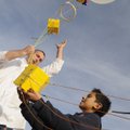 UP AND AWAY Matthew Garretty, left, science teacher at Old Wire Road Elementary School in Rogers, he...