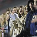 Shiloh Christian School senior Brittney Harper, center, cheers on Friday from the student section du...