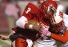 Arkansas Democrat-Gazette/STEVE KEESEE 12/11/10 Quarterback for the Rivercrest Colts Demoine Brown collides with a Harding Academy defender Saturday in the 3A football state championship at War Memorial Stadium in Little Rock Saturday.