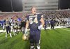 Shiloh Christian senior tackle Travis Bodenstein celebrates the Saints’ 61-40 win over Pulaski Academy on Friday in the Class 4A state championship game at War Memorial Stadium in Little Rock.