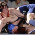Rogers Heritage’s Tylor McMurtrey, top, works to get Conway’s Elliot Lusby onto his back during thei...