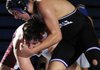 Fayetteville’s Dalton Alston, top, fights to take McDonald County’s Daniel Sumler to the ground during their 189-pound match Saturday in the NWA Duels wrestling tournament at Springdale Har-Ber High School in Springdale. Sumler won the match with a pin.