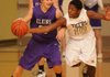 Bentonville guard William Worthey, right, tries to strip the ball from Elkins’ Mackenzie Leichner on Monday in Tiger Arena in Bentonville.