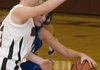 Siloam Springs’s Makenzie Sharp reaches for the basketball as she blocks the progress of Rogers High’s Lydia Wilkerson during the first half Monday in Siloam Springs.