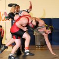 McDonald County’s Daniel Sumler shakes off Bentonville’s Kylan Larsen during their 189-pound match T...