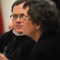 Mark Kinion, incoming Fayetteville alderman, listens Wednesday to city clerk Sondra Smith explain Ci...