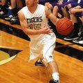 Bentonville guard Logan Pearson drives to the basket Monday against Elkins in Tiger Arena in Bentonv...