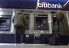 Customers use the automated teller machines Thursday at Citibank’s banking center in New York’s Union Square.