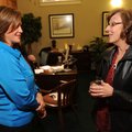 NONPROFIT RECEPTION | Mary Beth Brooks, president of the Bank of Fayetteville, left, speaks Thursday...