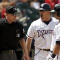 Northwest Arkansas manager Brian Poldberg and Manny Pina, right, plead their case to home plate umpi...