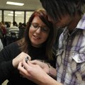 Springdale High School seniors Terah Brewer, left, and Tyler Davis compare class rings Thursday afte...