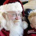 Santa Claus poses for a photo with a fan during last year’s Children’s Christmas Train on the Arkans...
