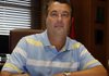 Secretary of State candidate Mark Wilcox works at his desk in the Land Commisioner's office at the state capitol.