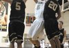 West Fork’s Cody Cone, left, and Logan Genz, right, try to block a shot by Bentonville’s Nick Smith during Friday’s game at Bentonville.