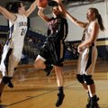 Siloam Springs’ Sarah Lowry, center, puts up a shot between Shiloh Christian’s Hannah Persing, left,...