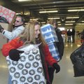 Saunya Burden, foreground, and other Sharing and Caring volunteers scurry Friday to distribute prese...