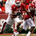Arkansas’ Jarius Wright attempts to break away from an Ole Miss tackler on Oct. 23 in Reynolds Razor...