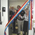 Maj. Tim Williford watches Tyson Foods’ Archie Schaffer and Annetta Young cut the ceremonial ribbon ...