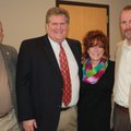 Northwest Arkansas Newspapers director and former publisher Tom and Jennifer Stallbaumer, from right...