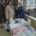 Hospital volunteers Pat Schamber and Isabelle Minton chat while selling the volunteers’ handmade goo...