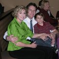 Anita and Brad Karren and their son, Nicholas, enjoy the holiday party for Rogers Little Theater. 