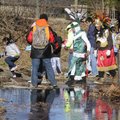 Walkers cross a creek Sunday during a rest break at Gulley Park in Fayetteville.