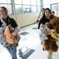 TOY DONATION Casey Springer, left, Children’s Safety Center lead child advocate, helps Springdale Hi...