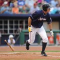 Northwest Arkansas Naturals hitter Clint Robinson watches his RBI single make its way to the outfiel...
