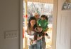 Henri and Keren Martinez, and their children, Antwan and Kimberly, enter their new home Saturday in Little Rock.