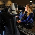 Lindsey Magee, a dispatcher for the Washington County Sheriff’s Office, records information Friday a...