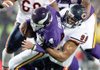 Chicago Bears rookie defensive end Corey Wootton (98) tackles Minnesota Vikings quarterback Brett Favre (4) during the second quarter of Monday’s game in Minneapolis.