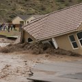 A house in the Beaver Dam Resort area falls into the Beaver Dam Wash in Beaver Dam, Ariz. Tuesday, D...