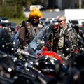 Bill Boscia, left, of Fayetteville and Mike Diacheysn of Farmington look over motorcycles parked in ...