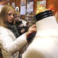 Jennifer Keeler holds her son Boston, 2, while shopping for last-minute Christmas gifts Thursday at ...