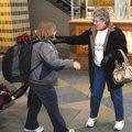 Edith Griffen, right, greets Lanell Allen at Northwest Arkansas Regional Airport on Christmas Eve in...