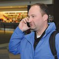 Navy Cmdr. Ted Sego calls his family to let them know of his arrival at Northwest Arkansas Regional ...