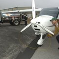 Don Splichal with Beaver Lake Aviation removes a grounding device from an airplane after fueling it ...