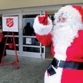 SHOPPING WITH SANTA Santa welcomes customers Friday to the Walmart Neighborhood Market on East Robin...