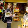 Caryn Finney of Fayetteville looks through some merchandise Thursday at Bella’s Gifts in Springdale....