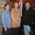Cindy Webb, left, and artist Matt Coburn, right, talk with Tracy and John Pelphrey at their home dur...