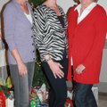 Life Styles Inc. board members Cyndy Spencer, from left, Hannah Lee and Karen McDonald welcome guest...