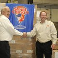 SMART GIVING David Wright, meat director for Harps, left, and Joe Horvath, account manager for Smart...