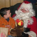 SITTING WITH SANTA The Ladies Auxiliary of Veterans of Foreign Wars Post 3031 held its annual Childr...