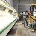  Brad Carpenter, with Airworks working with Multi-Craft Contractors, cleans up after helping to inst...