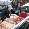 Ceng Lee and his wife Vang Lee sort through tomatoes while selling produce Saturday, Nov. 20, 2010, ...