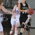Bentonville’s Shelby Walker drives the ball past Seneca, Mo., defenders in the second half Monday du...